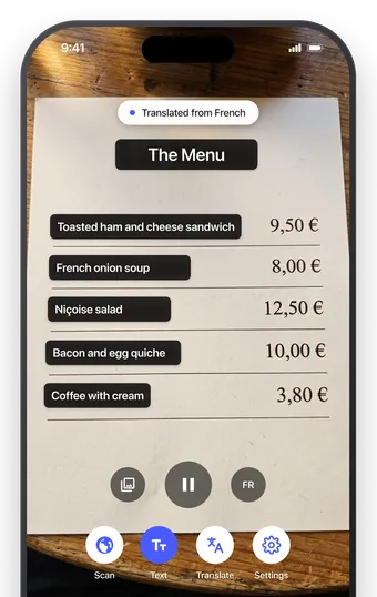 AI Translate's live camera pointed at a French café menu, with the English translation shown over the menu text