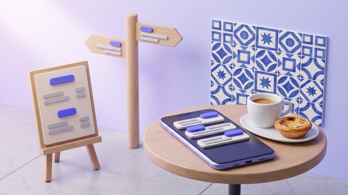 A phone on a round café table beside an espresso and a pastel de nata, with blue azulejo tiles behind and a menu board and sign covered in indigo translation chips